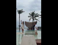 Woman beach dress selfie video at resort