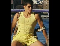 Collab IITW - Model sits on boat rail and looks into the distance then checks out photos