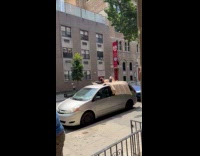 Man lie down on the car roof
