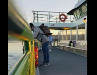 Girl blue jacket dance ferry deck announcement