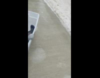 Baby in container slides down driveway 