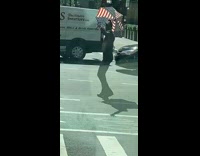 Guy dances american flag umbrella black pants 