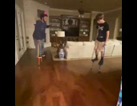 Guy on stilts breaks blue white vase 