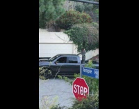 Girl poses on truck roof hollywood sign