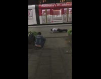 Man push up red electric train pass by