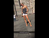 Blonde girl gets scared by bird while posing for picture