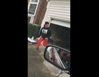 Guy runs out of garage before it closes and slips in snow, drops phone