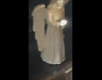 Sunlight reflect on praying hands of statue