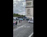 Tourists line for picture Arc de Triumphe