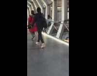 Woman picture behind rails glass bridge