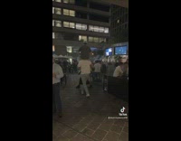 Two guys dab it up and then carry each other away