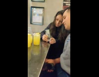 Guy adjusts pineapple slice for photo 