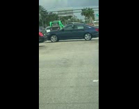 Man drives forklift helps stuck vehicle on the street