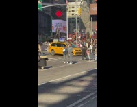 Two men tiktok dance in the middle of the street