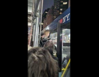 Baby stroller stuck between bus and scaffolding