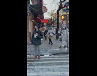 Drag queen poses in front of restaurant windows 