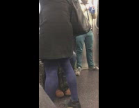 Bearded Guy Knits Blue Yarn In Subway