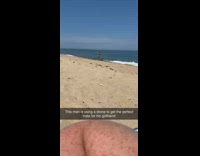 Girl poses beach shore flying black drone 