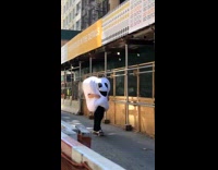 Large white tooth mascot skateboards down street 