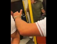 Bunch of guys on train dance and cheer 