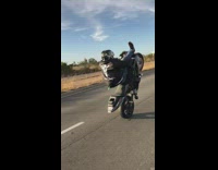 Motorcyclist wheelie on road fail 