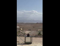 Woman in black dress bikini tiktok dance at the desert