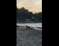 Guy lay beach lift butt yoga stretch