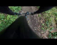 Guy rides blue bicycle over bump fail