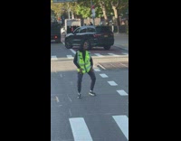 Traffic enforcer woman dance in the middle of the road 