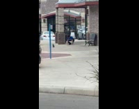 Man headstand on the sidewalk for video