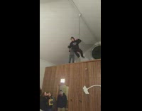 11 Black Sweater Elbow Drops Grey Table Off Brown Wall People Cheer