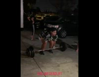 Girl lifts weights and black shirt dad 