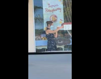 Woman blue dress selfie with cake on hand