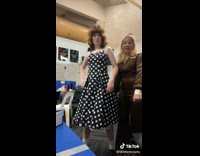 Lady in Dress Twists Body to Dance