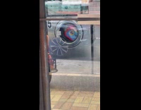Laundry detergent bottle spins inside washing machine