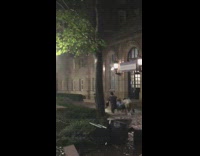 Group of students on white boat flooded campus