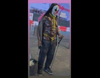 Oily man in clown makeup dances 