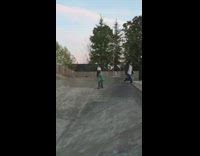 Green shirt little boy falls off skateboard 