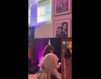 Woman wears Spy Balloon costume at party