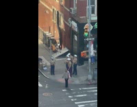 Group of navy men at corner of intersection