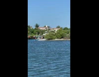 Guy does handstand on sand blue kayak 
