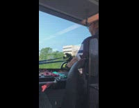 Train conductor driver working out blue resistance band 