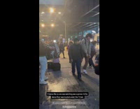 Man dances to band performing on street