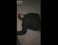 Drunk guy rolls across street black jacket 