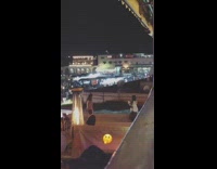 Girl dances to beat of drums for picture