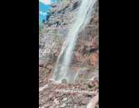 Girl blue mermaid tail sit side waterfalls