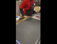 Roll of mints rolls on check out conveyor belt 