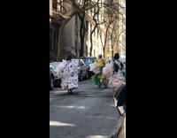 Three Ladies Dressed in Large Ruffles Dance 