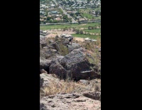 Man tank top dances on the rock