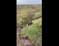 Boy jumps over river to avoid wet